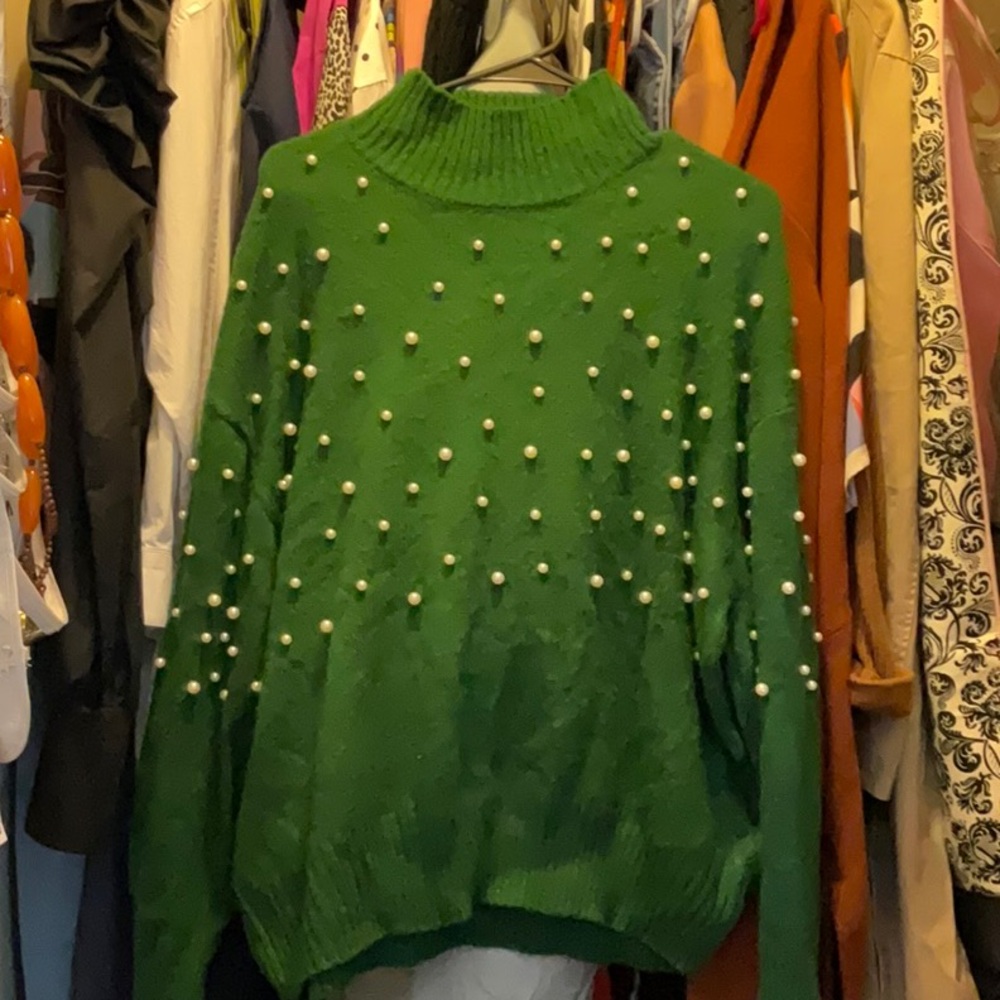 Winter green sweater with pearls.